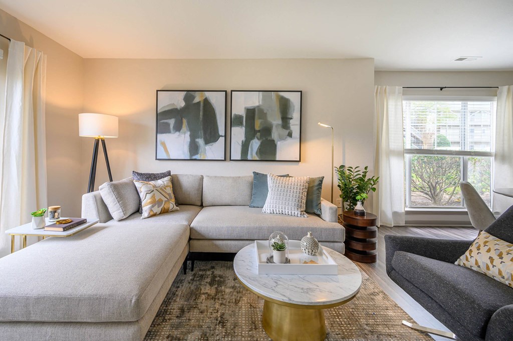 a living room with a couch and a coffee tableat Ashford Green, Charlotte, North Carolina 28262