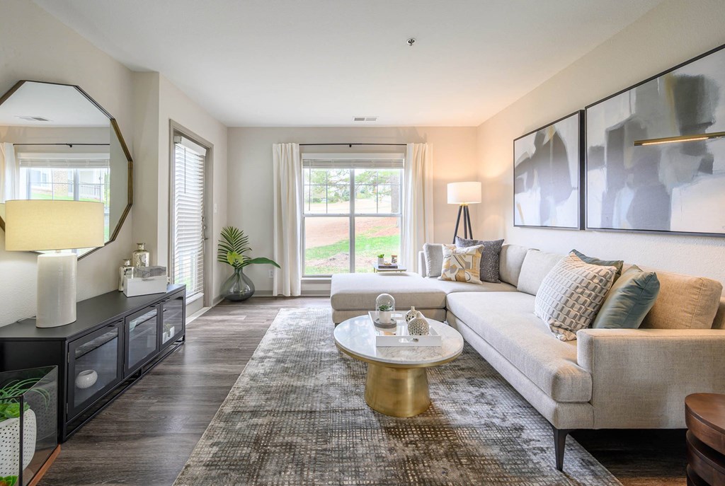 a living room with a couch and a coffee tableat Ashford Green, Charlotte, 28262