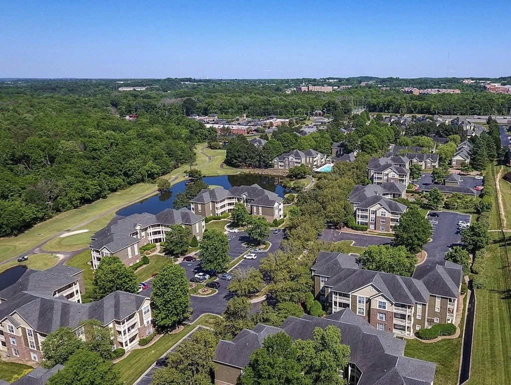 an aerial view of a neighborhood with houses and a pond at Ashford Green, NC 28262