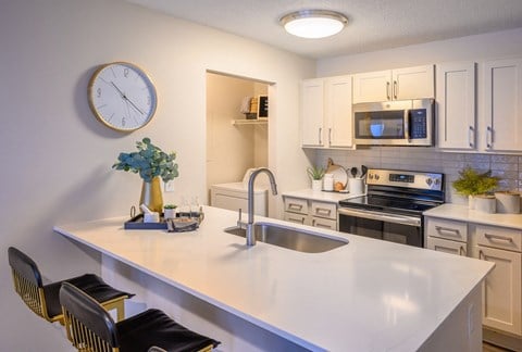 the preserve at ballantyne commons apartment kitchen with quartz counter top and stainless steel