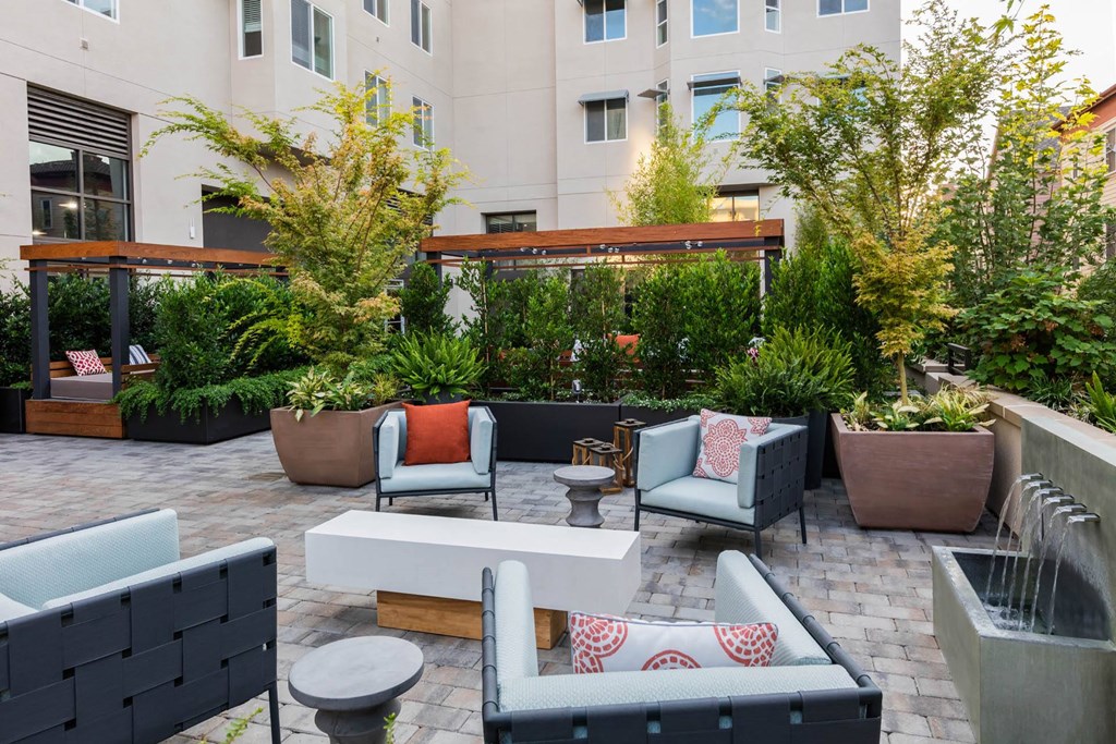 Chairs in courtyard seating area at Aventine, California, 94547