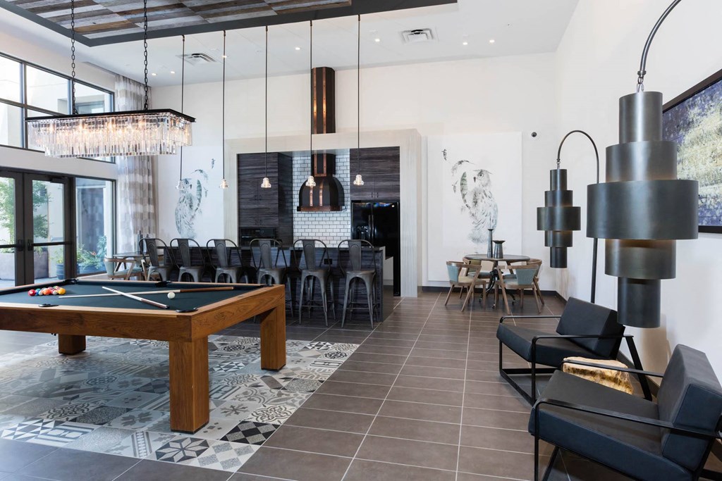 Pool table and kitchen area in newly renovated clubhouse at Aventine, California, 94547