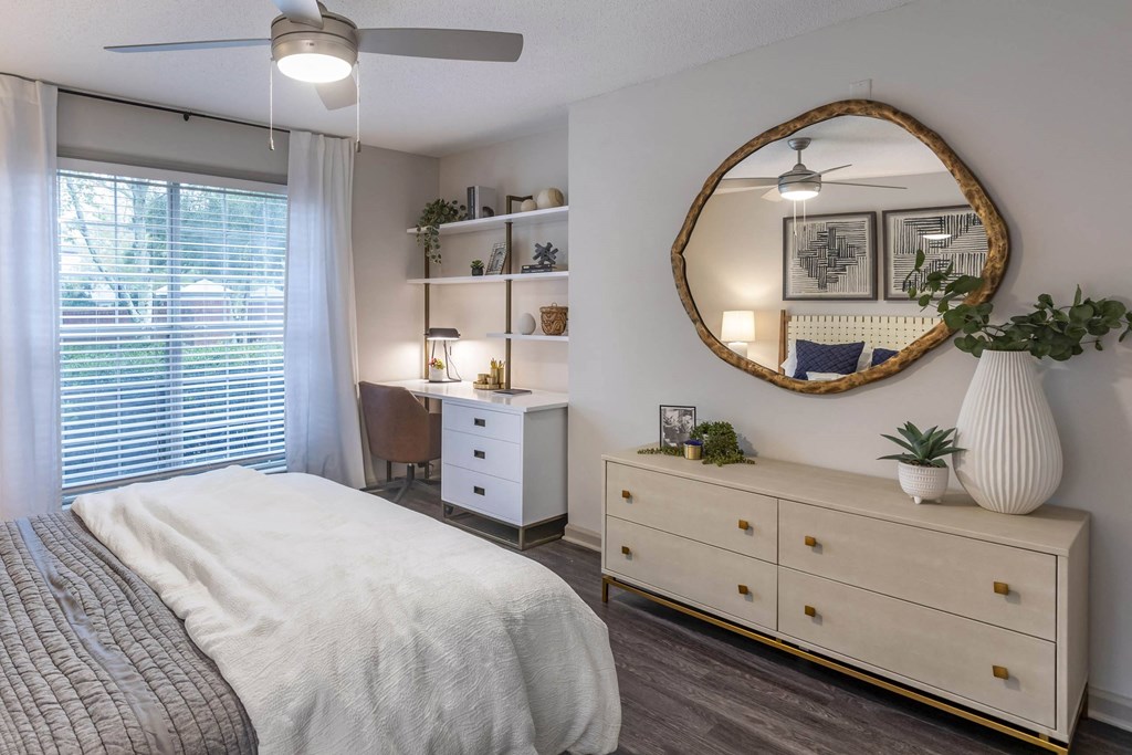 a bedroom with a bed and a mirror a bedroom with a bed and a mirror at Roswell Village, Roswell, Georgia