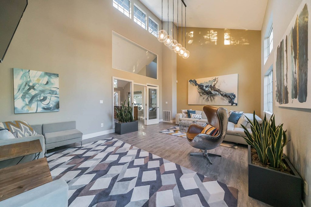 a living room with a couch and a chair in front of a window at Bay Village, California, 94590
