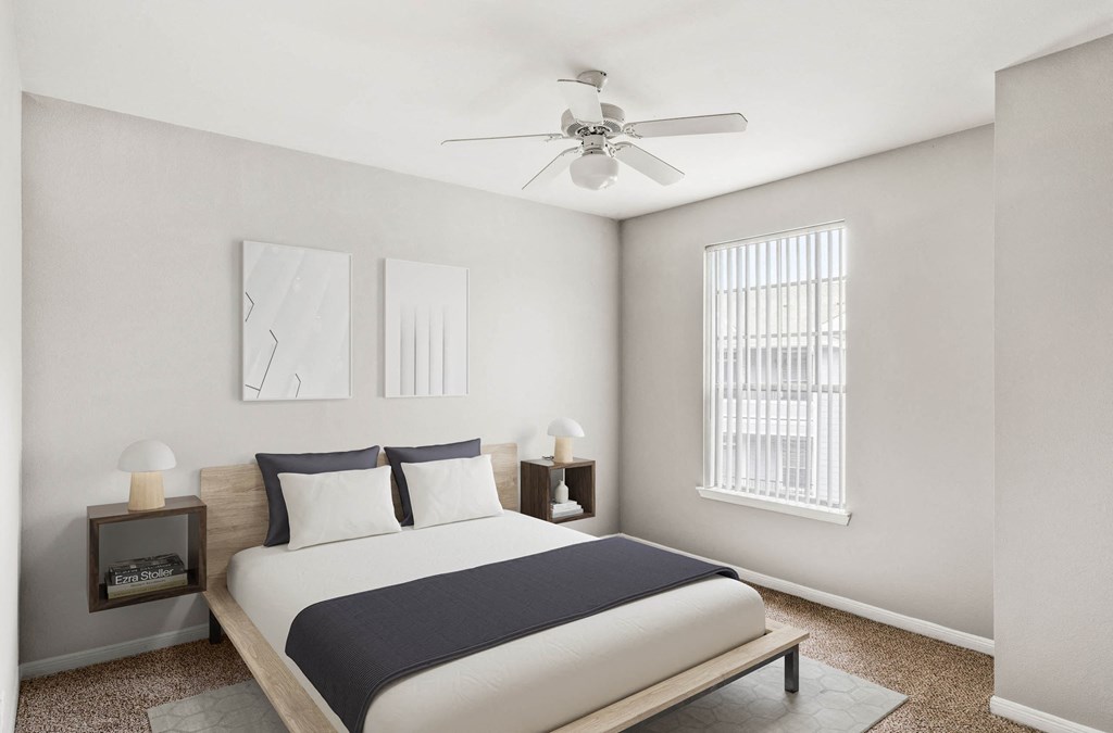 a bedroom with a bed and a ceiling fan at Veranda at Centerfield, Texas, 77070