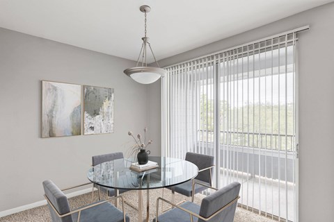 a dining room with a glass table and chairs at Veranda at Centerfield, Houston, TX, 77070
