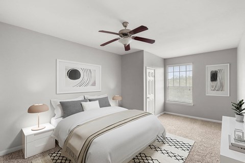 a bedroom with a large bed and a ceiling fan at Veranda at Centerfield, Texas