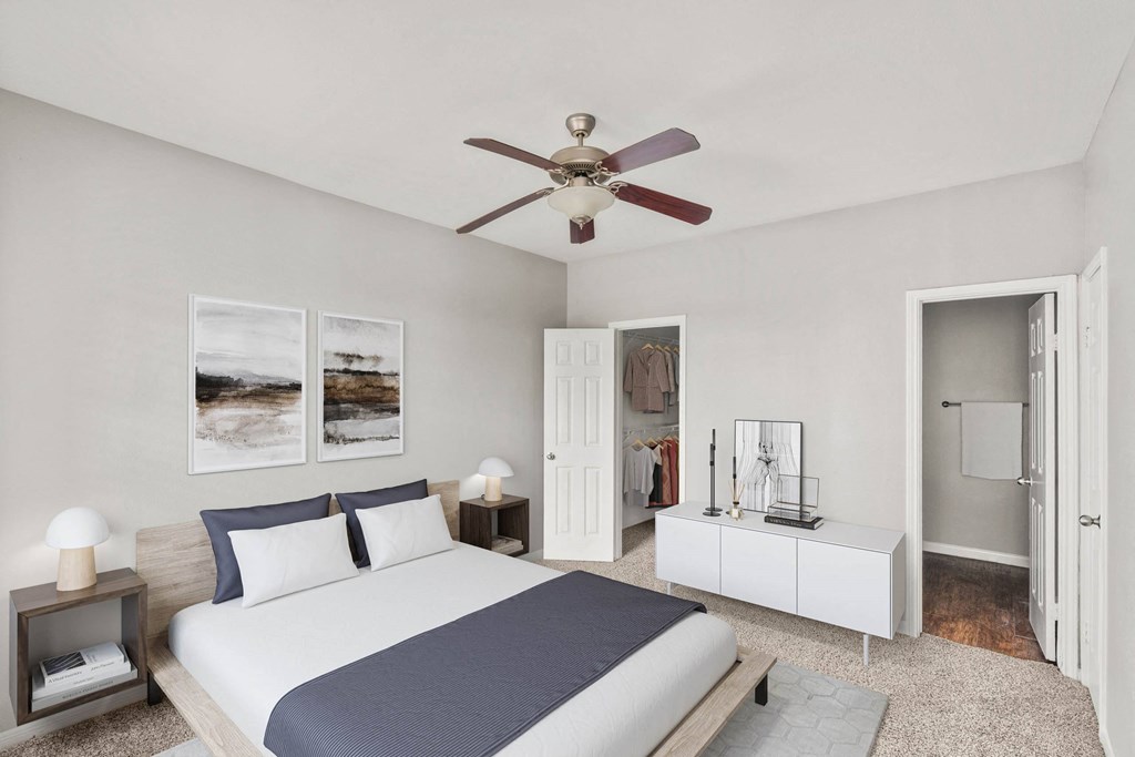 a bedroom with a large bed and a ceiling fan at Veranda at Centerfield, Houston, TX