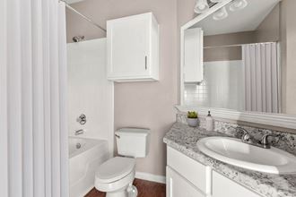 a bathroom with a sink toilet and a bath tub at Villages of Cypress Creek, Houston, TX, 77070