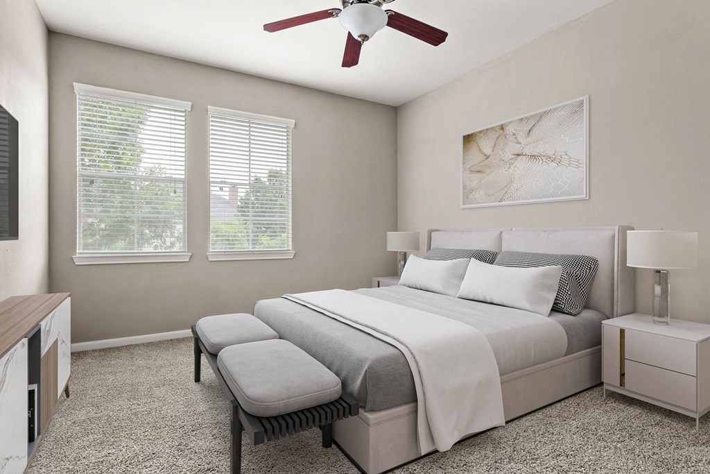 a bedroom with a bed and a ceiling fan at Villages of Cypress Creek, Texas