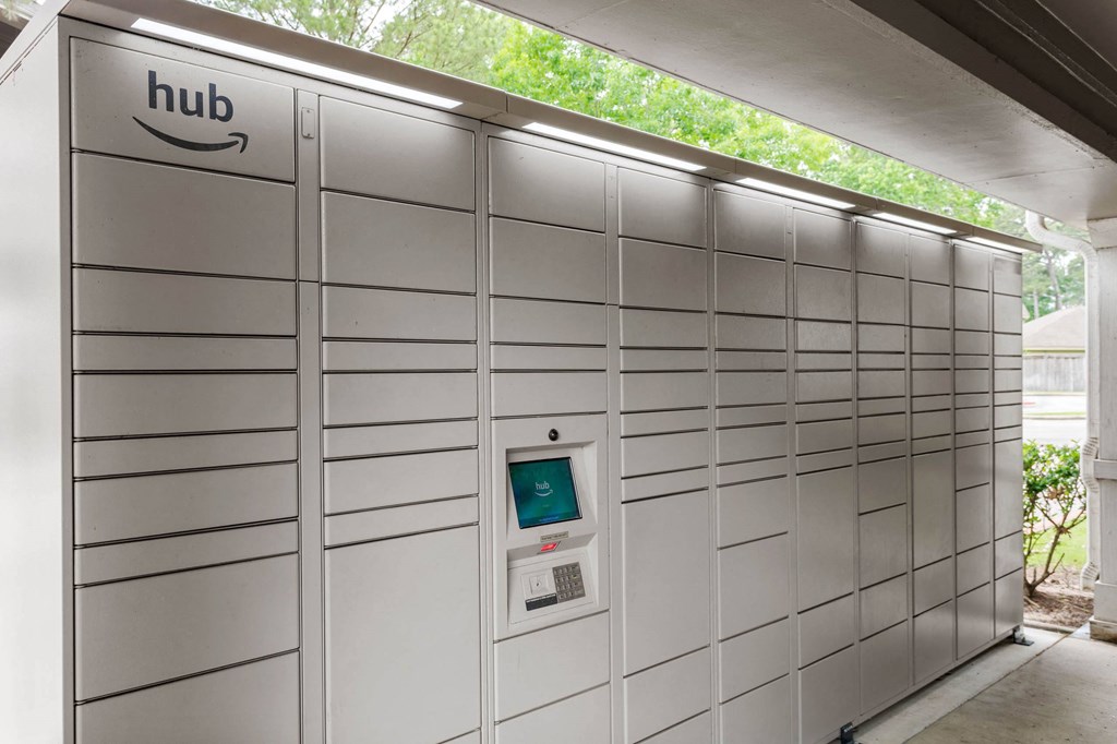 the automated parking meter is in the wall of a garage at Villages of Cypress Creek, Houston