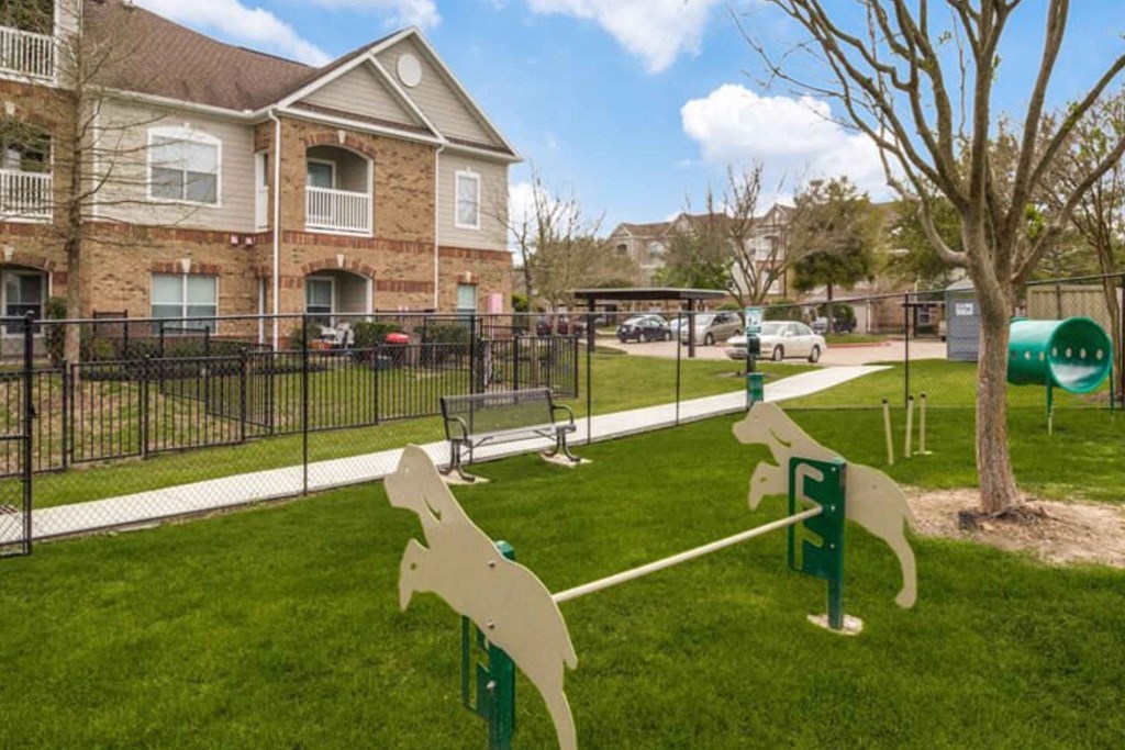 a dog park in front of a house at Carrington at Barker Cypress, Cypress