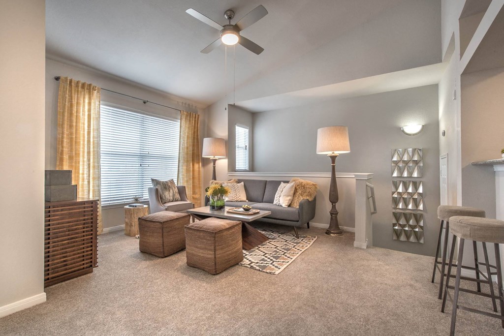 a living room with a couch and a ceiling fanat Creekside at Legacy, Plano, Texas 75024
