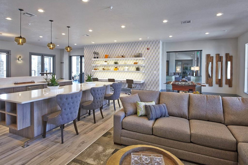 a living room with a couch and a bar and a kitchenat Creekside at Legacy, TX 75024