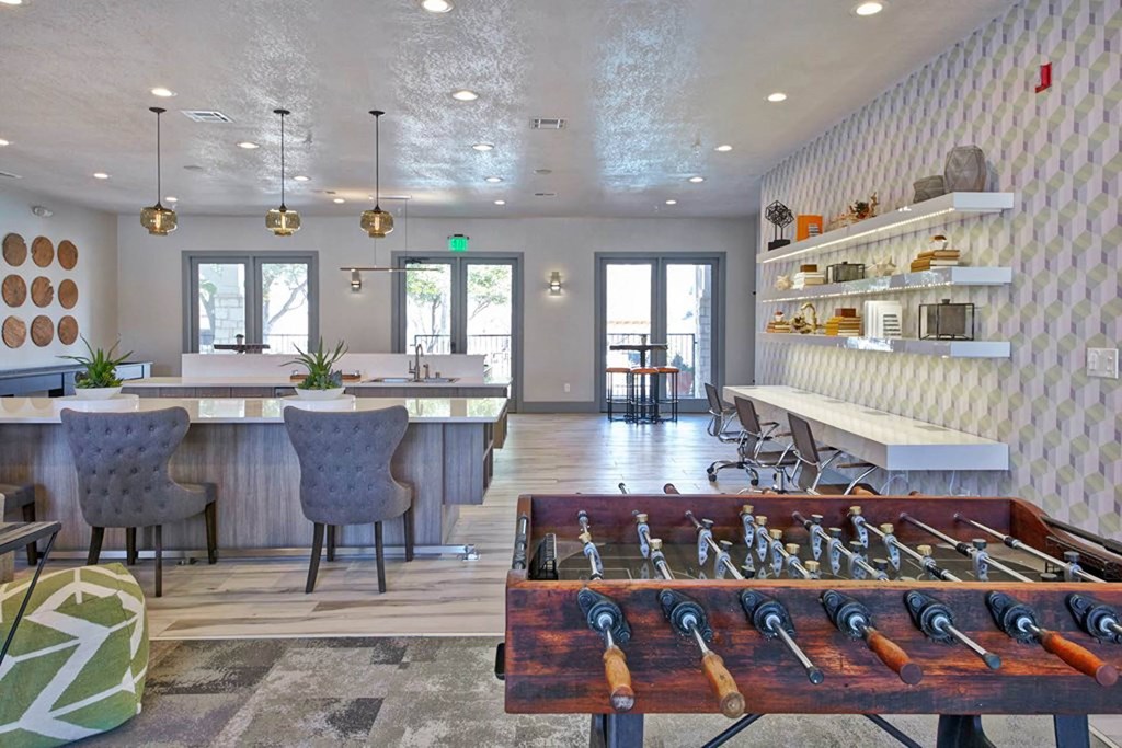 a recreation room with a foosball table and a barat Creekside at Legacy, Texas, 75024