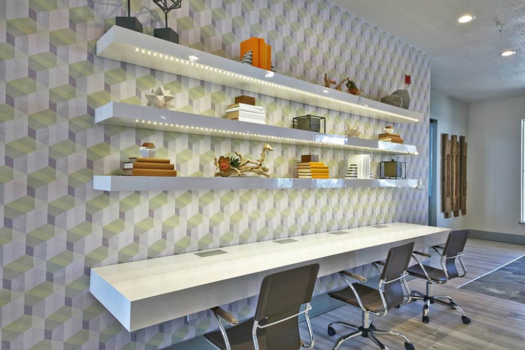 a long desk with chairs in a room with a tile wallat Creekside at Legacy, Plano, TX