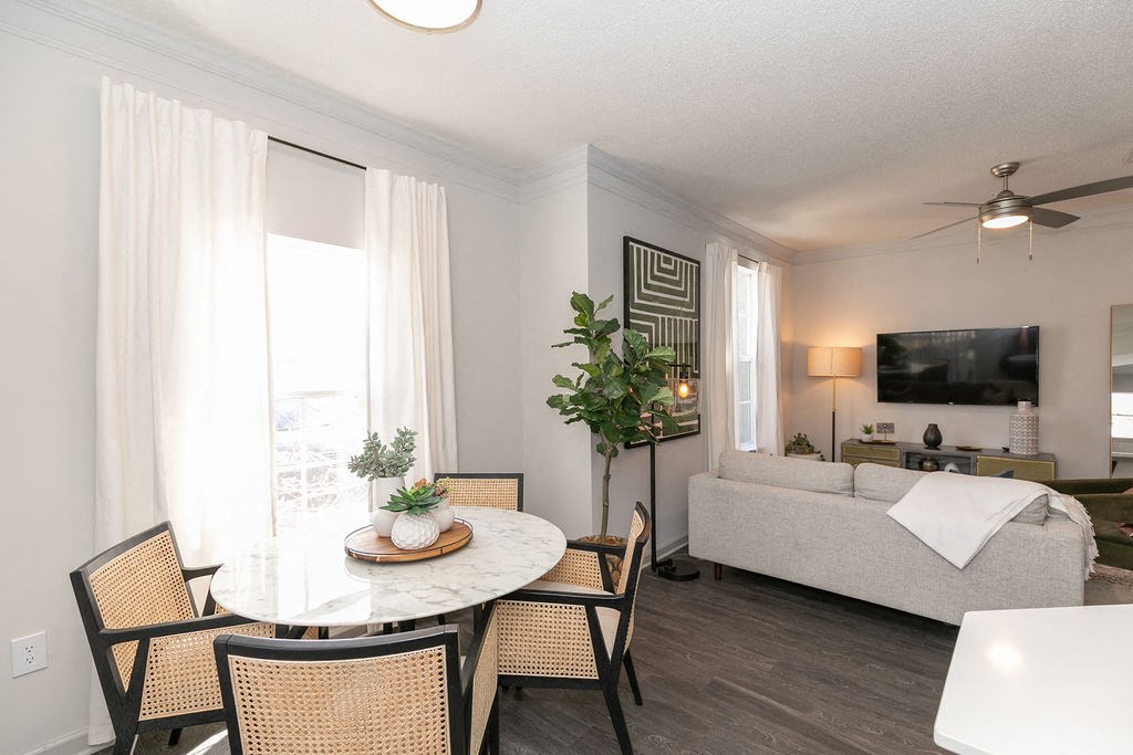 a living room and dining room with a couch and a table at Deerfield Village, Georgia