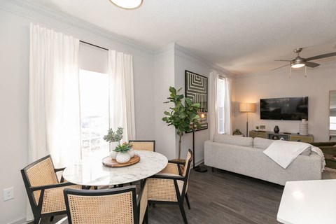 a living room and dining room with a couch and a table at Deerfield Village, Georgia