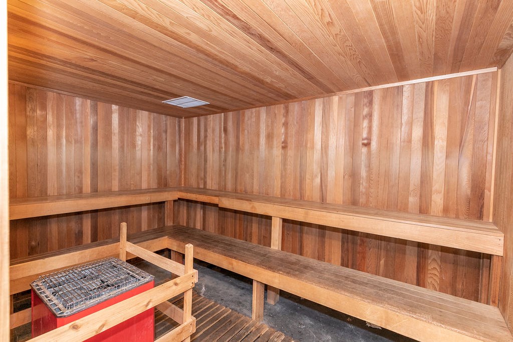 a wooden sauna with benches and a table at Deerfield Village, Alpharetta, GA