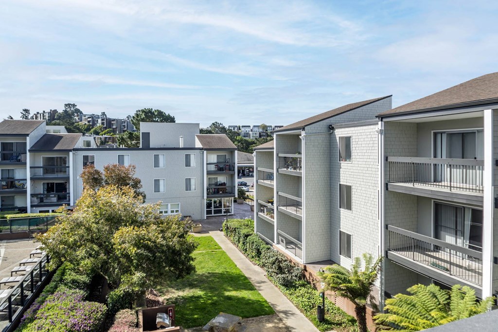 an aerial view of an apartment complex with a lawn and trees at Delphine on Diamond, San Francisco