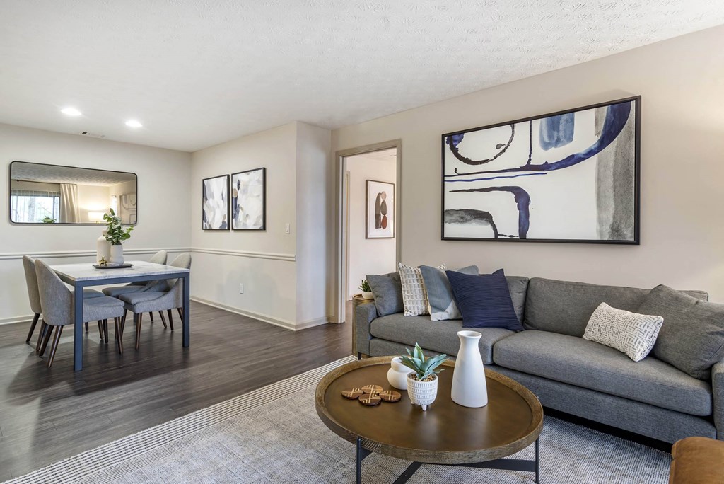 a living room with a couch and a table at Gwinnett Pointe, Norcross