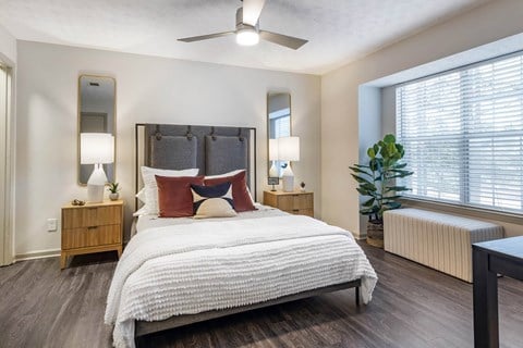 a bedroom with two beds and a large window at Gwinnett Pointe, Norcross