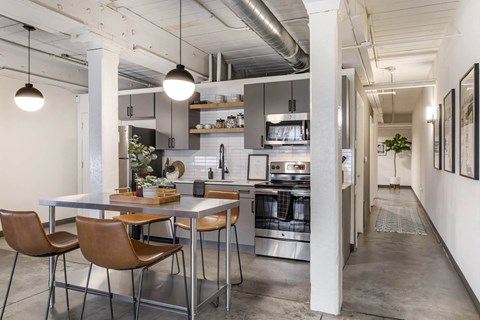 a kitchen and dining area in a loft at Highland Mill Lofts, Charlotte, North Carolina