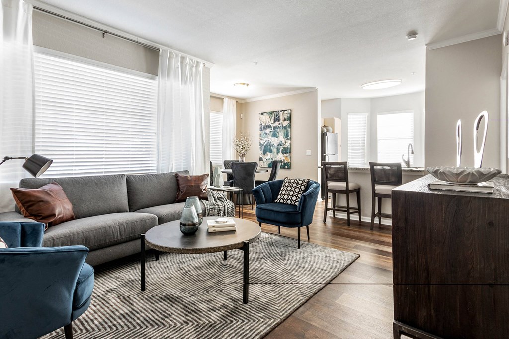 a living room with a couch and a table at The links at Plum Creek Apartments, Castlerock, CO