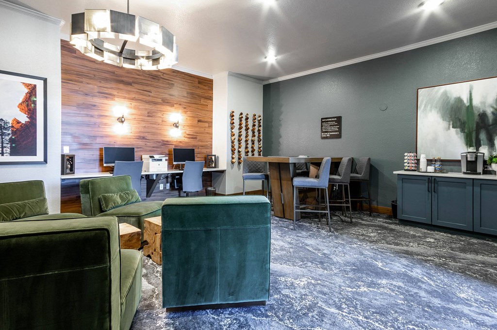 a living room with green furniture and a blue rug at The links at Plum Creek Apartments, Castlerock, CO 80104