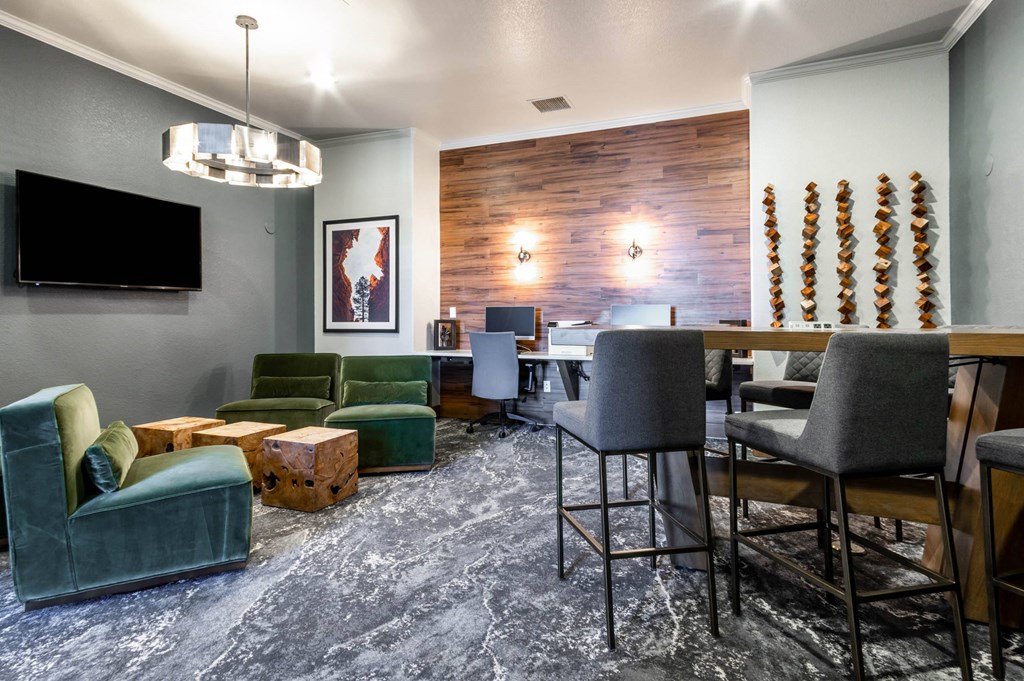 a living room with a bar and a dining room at The links at Plum Creek Apartments, Castlerock Colorado