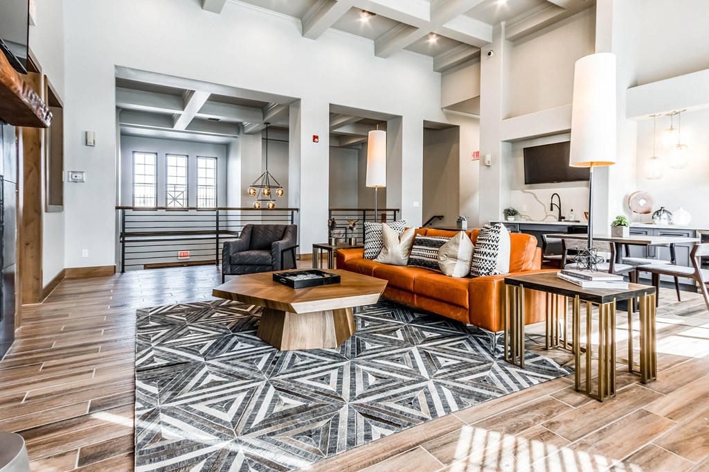 a living room with a couch and a table  at The links at Plum Creek Apartments, Castlerock, 80104