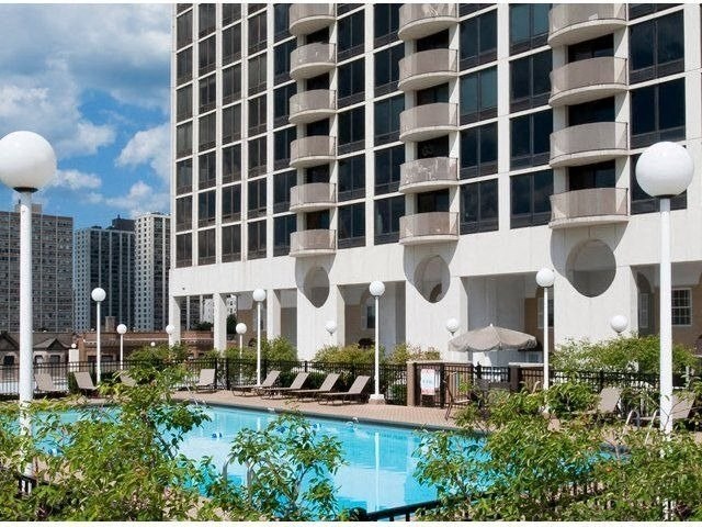 a large swimming pool in front of a building at The Montrose, Chicago, 60613