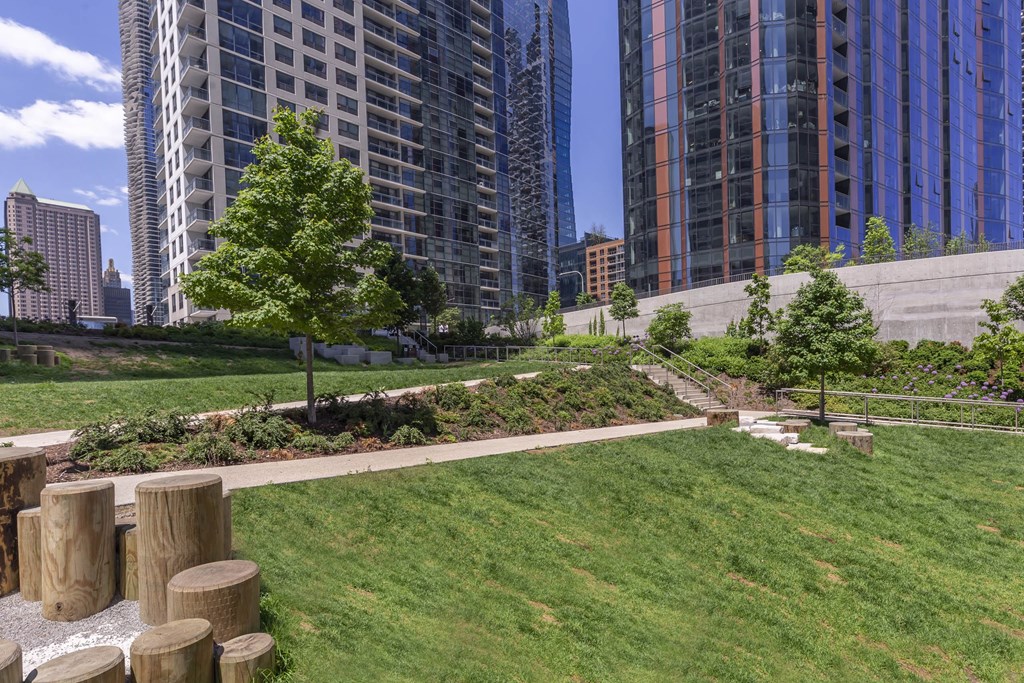 a park in the middle of a city with tall buildings at North Harbor Tower, Illinois