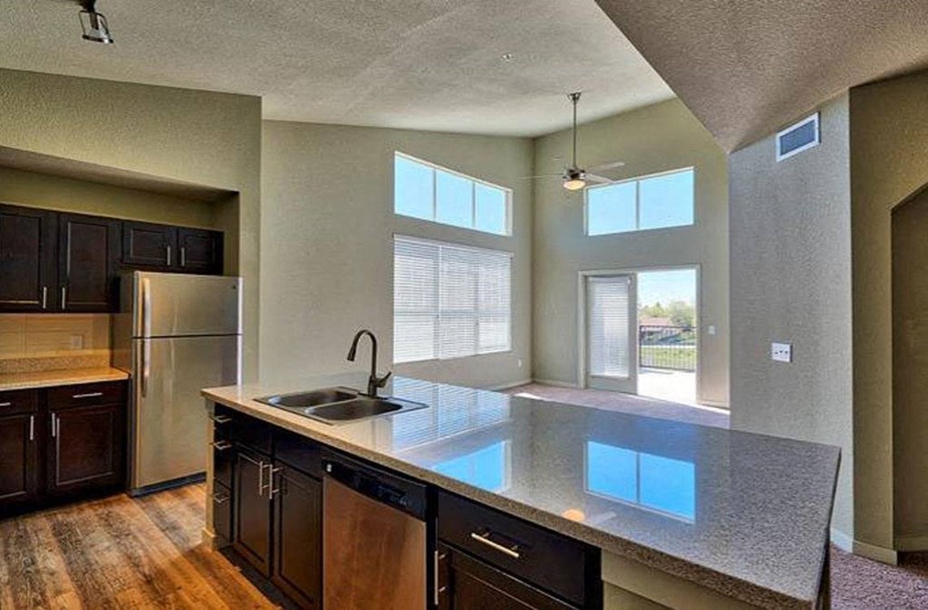 a kitchen with a counter top and a sink at Ridge at Thornton Station Apartments, Thornton, 80229