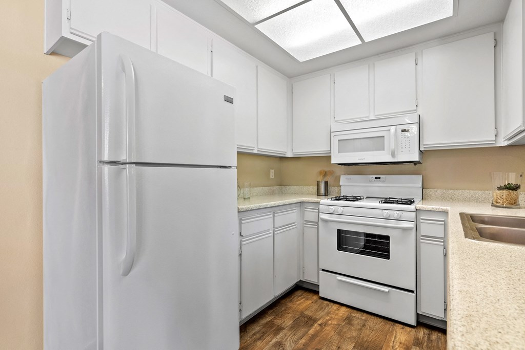 All-white kitchen at River Oaks in Oceanside, CA