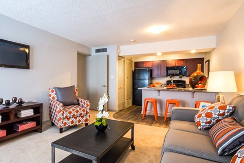a living room and kitchen with a couch and a table at Skyview Apartments, Westminster, CO