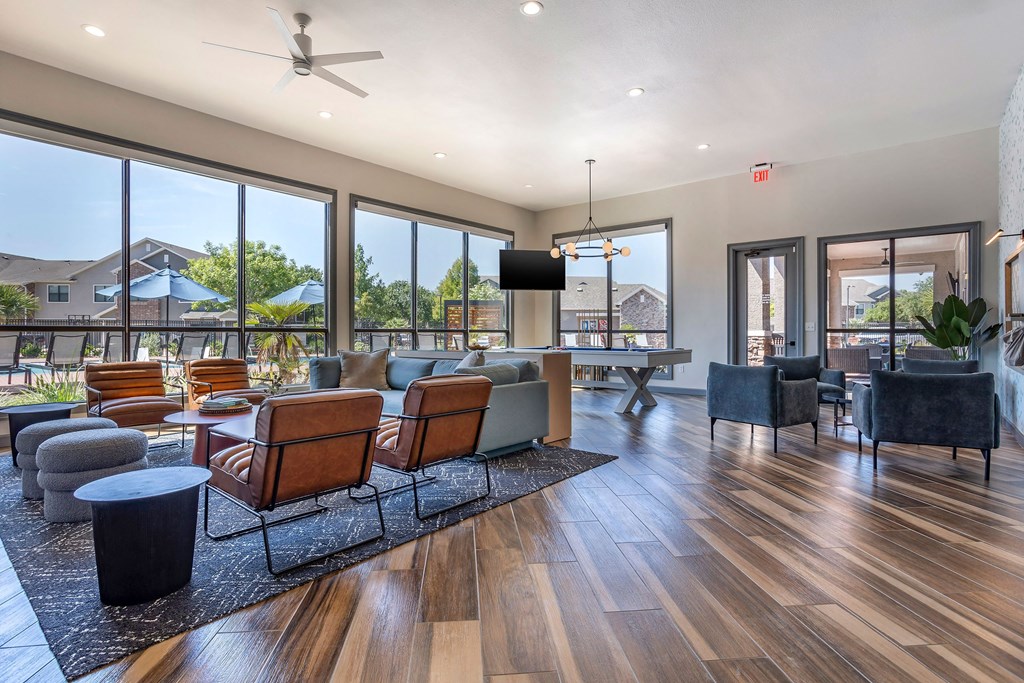 a living room with couches and chairs and a table at Sladestone Shadow Creek, Texas