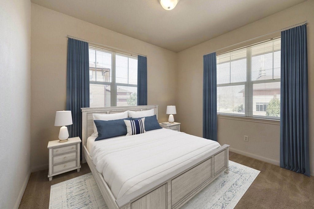 a bedroom with a bed and two windows a bedroom with a bed and two windows at Switchback on Platte Apartments, Littleton, 80120