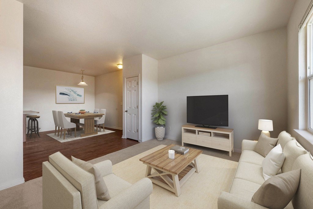 a living room with a couch and a television at Switchback on Platte Apartments, Littleton, Colorado