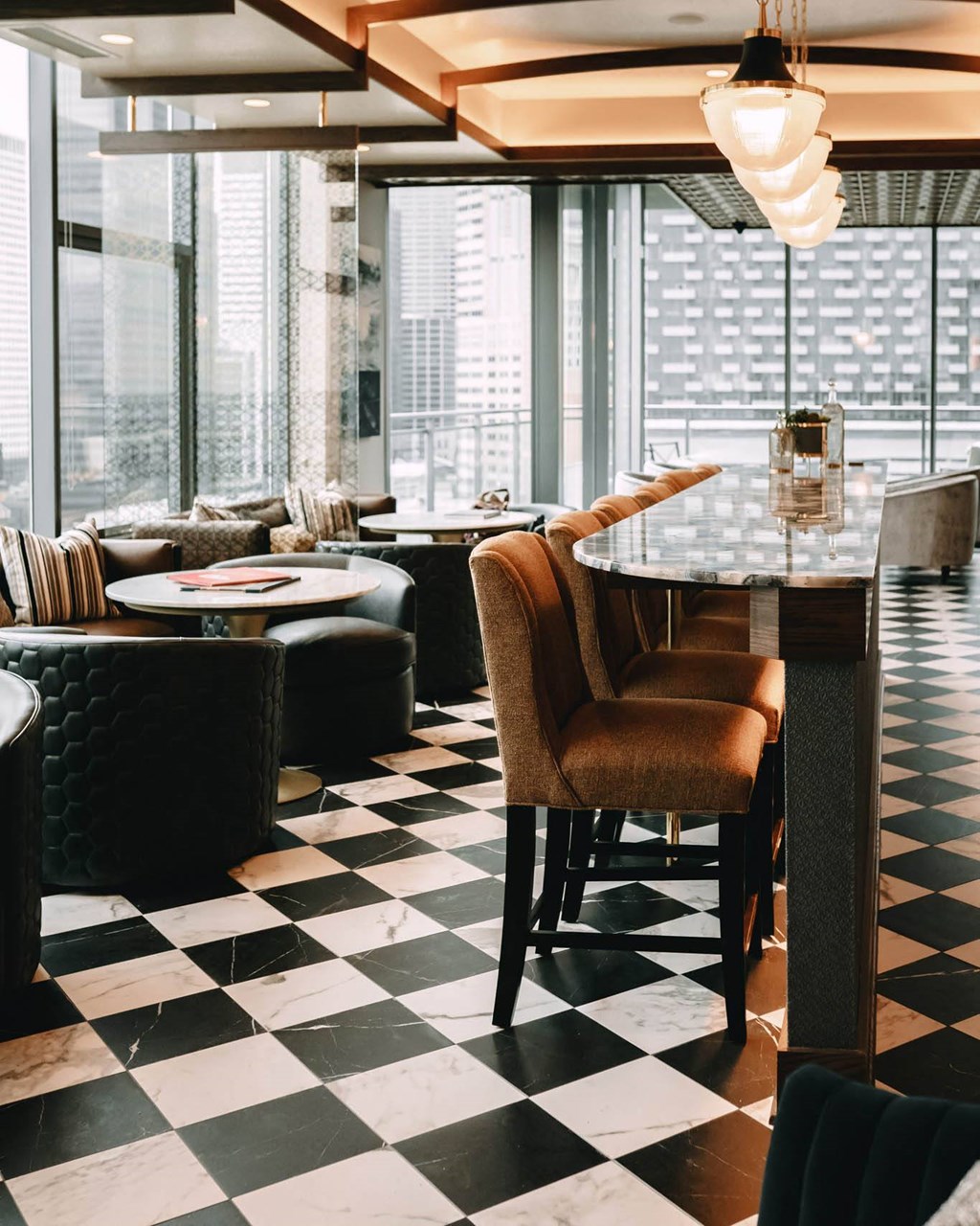 a lounge with a checkered floor and tables and chairs at The Grand Central, Illinois, 60607