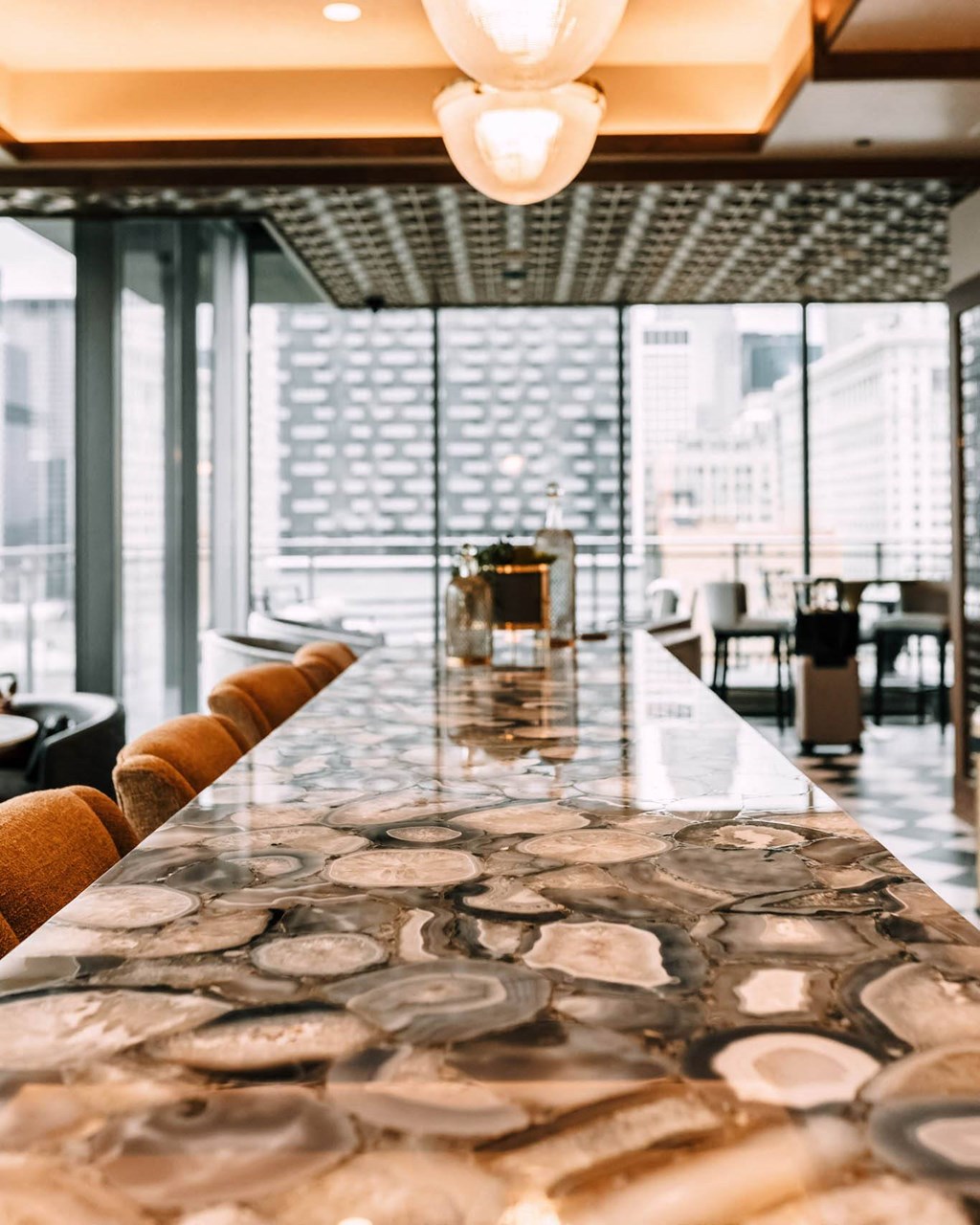 a long table with a view of the city at The Grand Central, Chicago