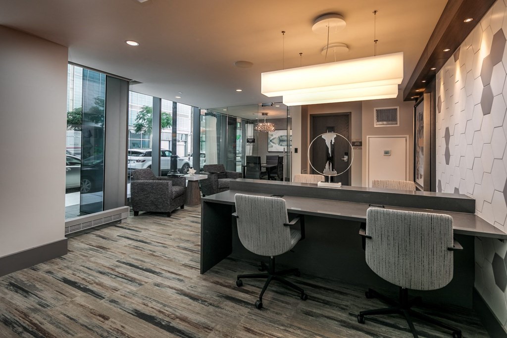 a conference room with chairs and a table and a large window at The Grand Central, Chicago, 60607