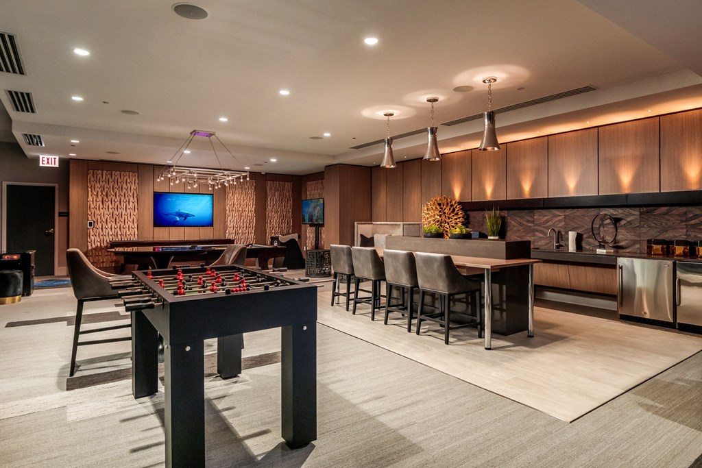 a game room with a pool table and a tv at The Grand Central, Illinois, 60607