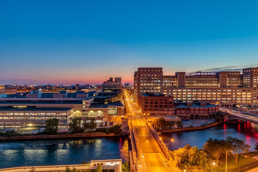 an aerial view of the city at night at The Grand Central, Chicago, 60607