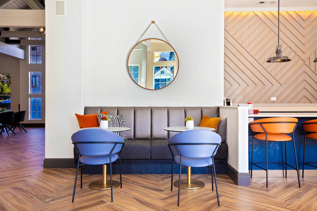 a dining room with a couch and tables at The Olivine, Austin, 78727