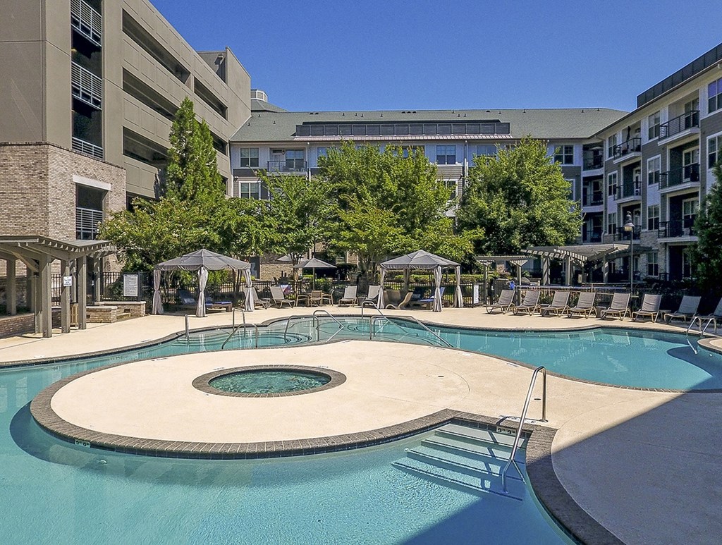 a large swimming pool with a building in the background at The Tribute, North Carolina