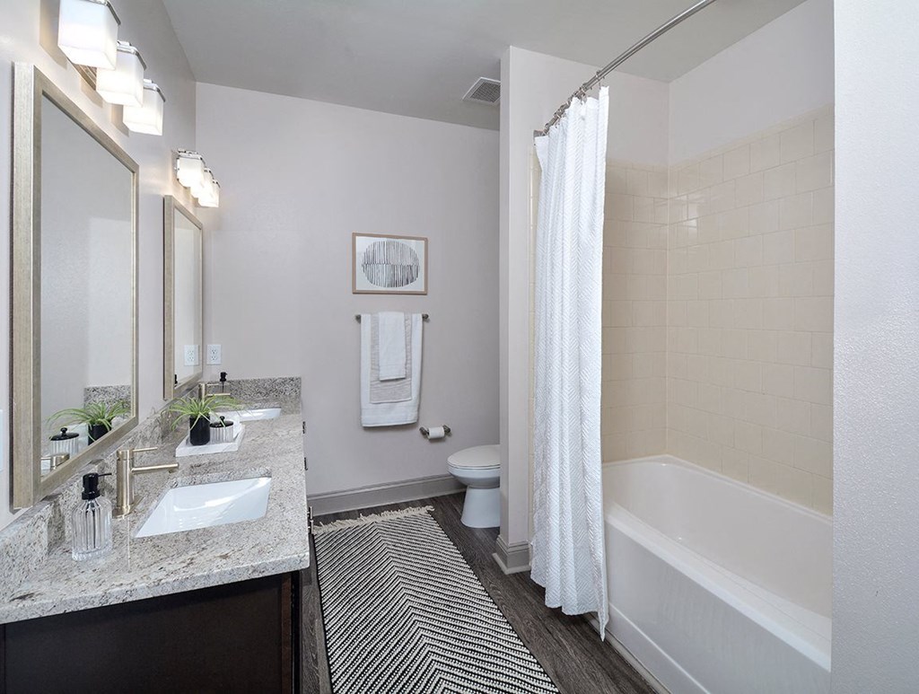 a bathroom with shower and sink at the Tribute at The Tribute, Raleigh, North Carolina