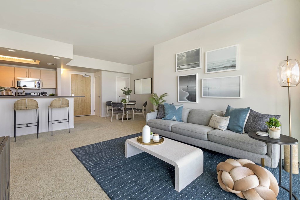 a living room with a couch and a table  at Vue, San Pedro, CA, 90731