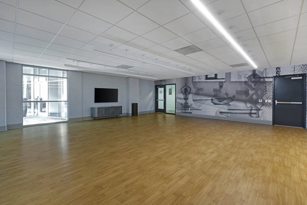 a large room with wood floors and a mural on the wall  at Vue, California, 90731