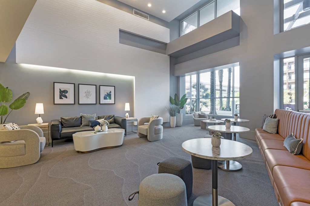 a large living room with couches and tables  at Vue, San Pedro, 90731